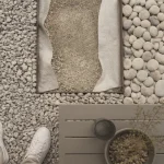 Vue terrasse en gravier : concassé 8/16, roulé, fondation sur géotextile